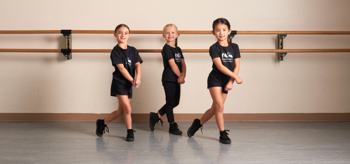 Dancers cross and step in pre-hip hop class