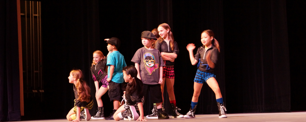 Dancers performing hip hop on stage